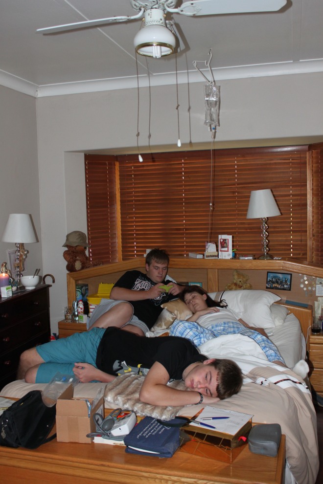 Boys lying with Vic before Chris' arrival